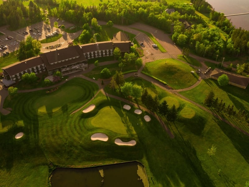 Aerial view of Mill River Resort in summer