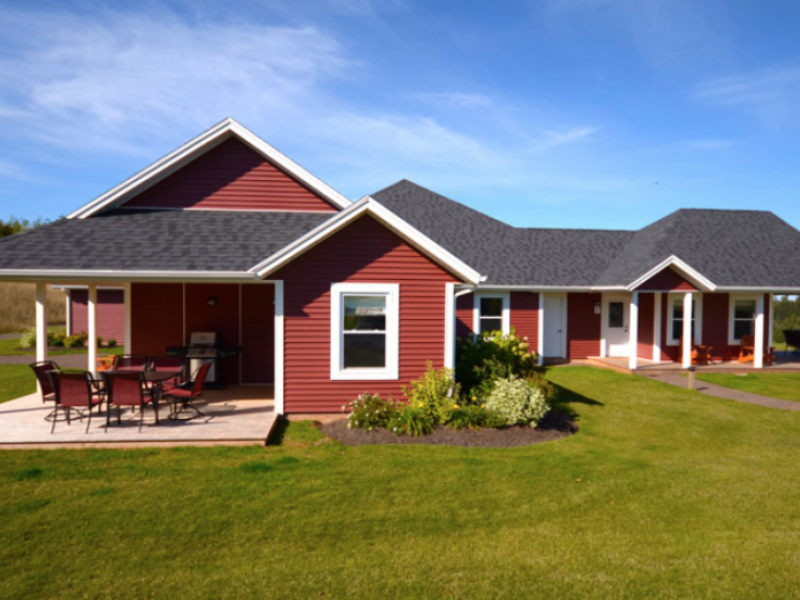 Outside view of the red cottage units at The Gables of PEI