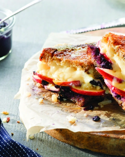 Image of Grilled Cheese with Apple + Wild Blueberry Chutney sandwich on cutting board