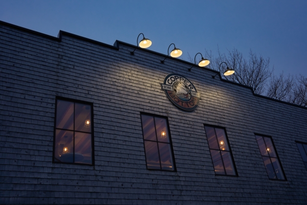 Exterior view of front of Copper Bottom Brewing at night