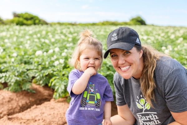 Keisha Rose and young girl in potato field of PEI