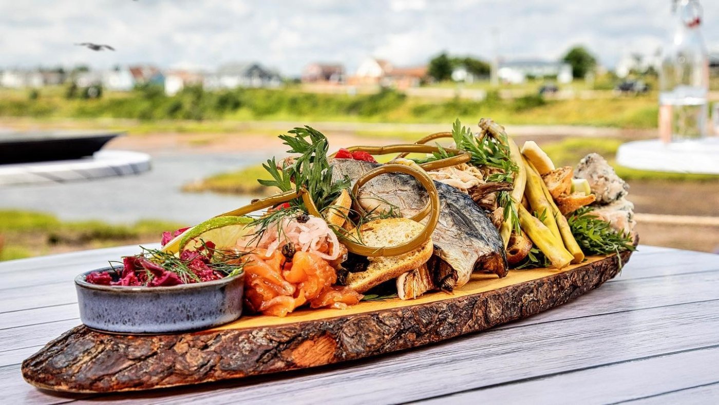 Seafood Chacuterie sitting on table with view of harbour in background