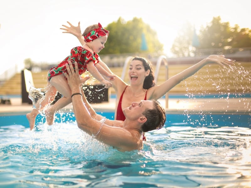 Family of three in the pool