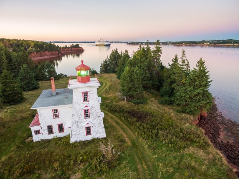 Aerial view of Blockhouse Lighthouse with cruise ship in background
