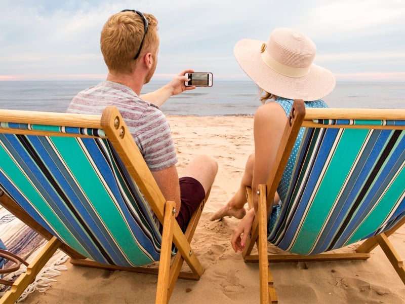Lakeside Beach, beach chairs, couple, sand, taking photo
