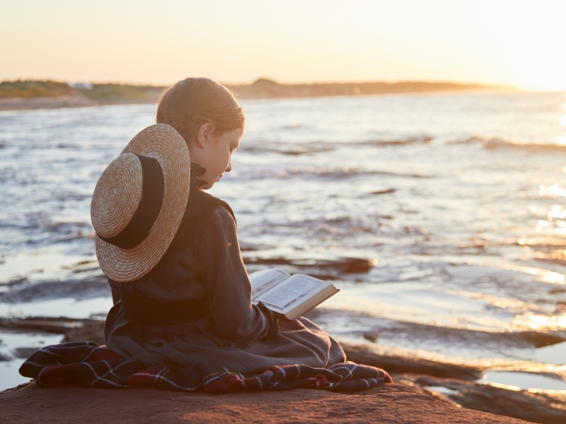 Anne of Green Gables reading on the beach