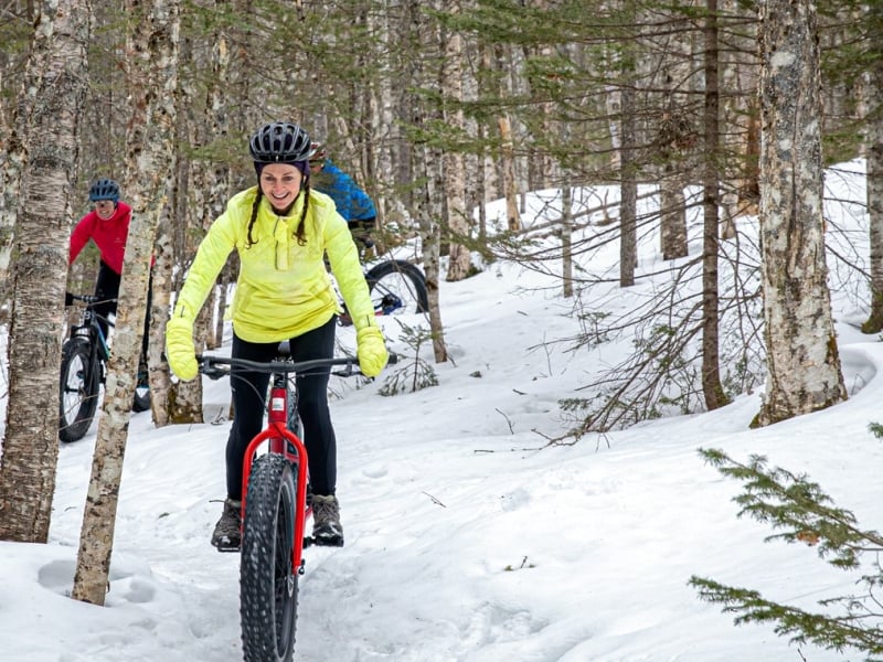 Group of three on fat bikes in winter, Bonshaw Provincial Park, PEI