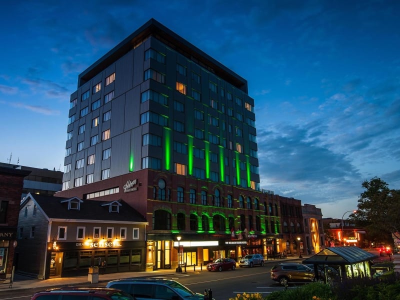Exterior view of the Holman Grand Hotel lit up at night