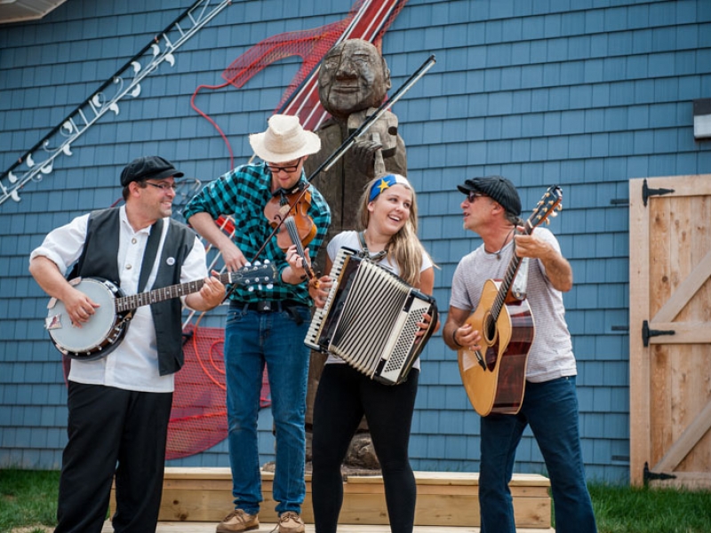 Group of four people playing instruments