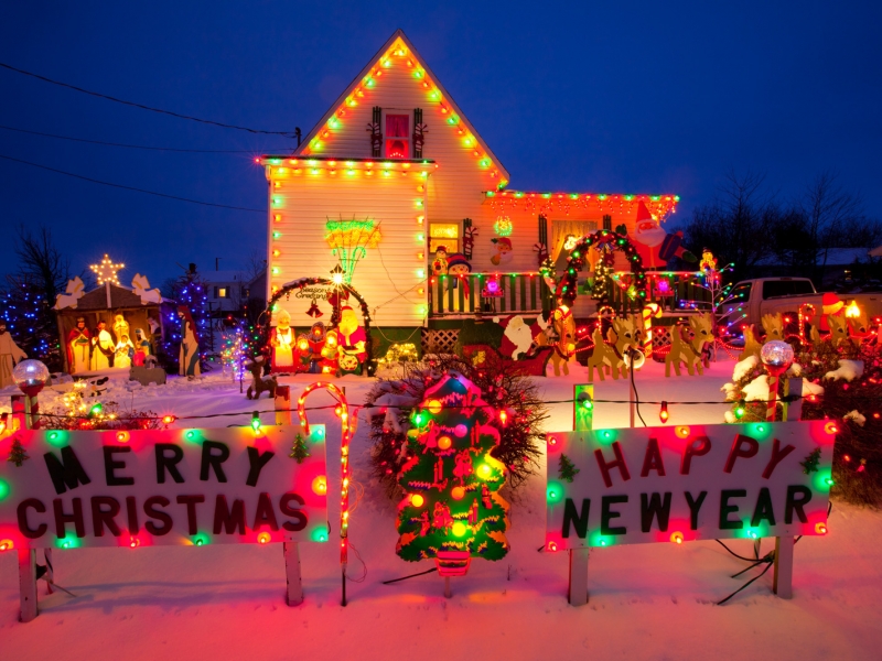 Small house decorated with holiday lights