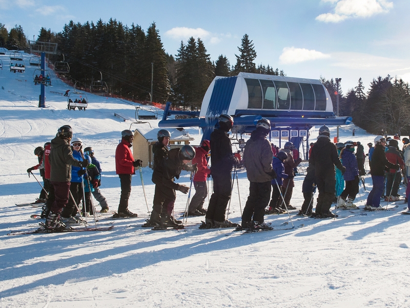 Image of group lined up for chair lift at Brookvale