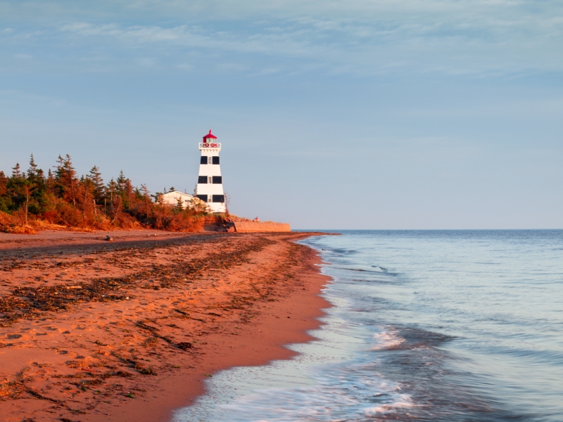 West Point Lighthouse West Point Lighthouse in distance and red sand beach in foreground