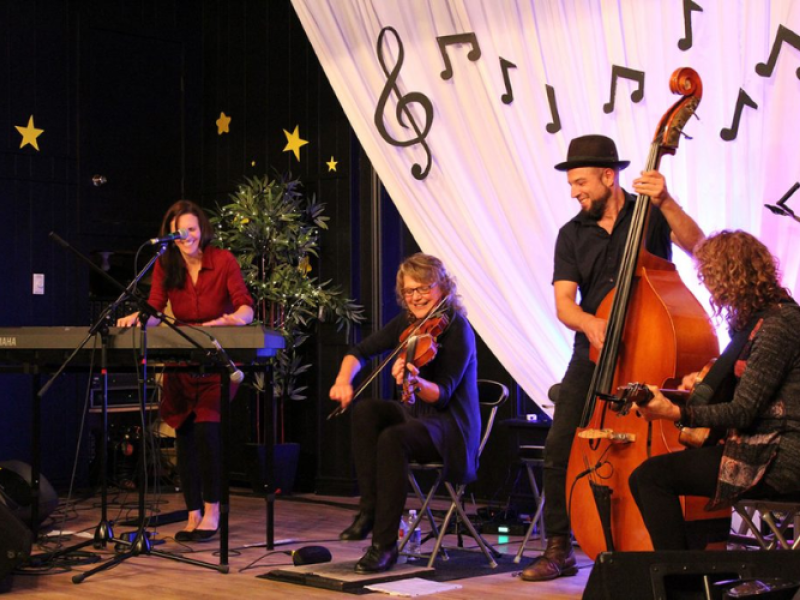 Group of musicians performing on stage