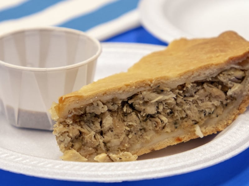 Paper plate on table with Acadian Meat Pie