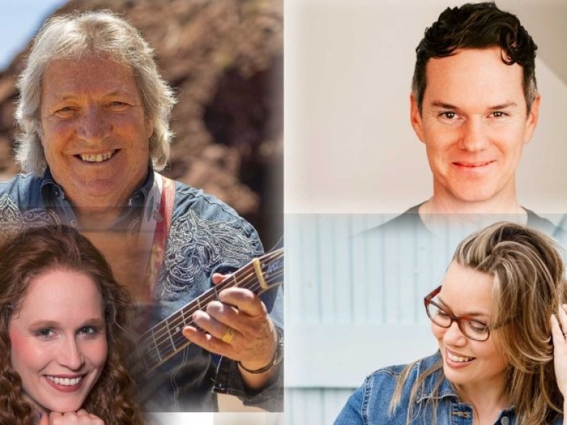 Image of four musicians smiling in Prince Edward Island  