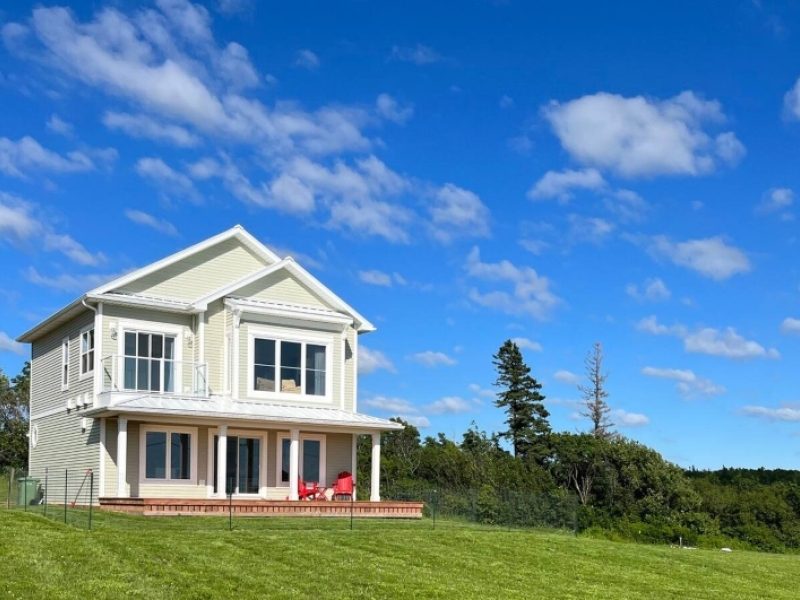 Large two-storey property overlooking a large front yard on a hill