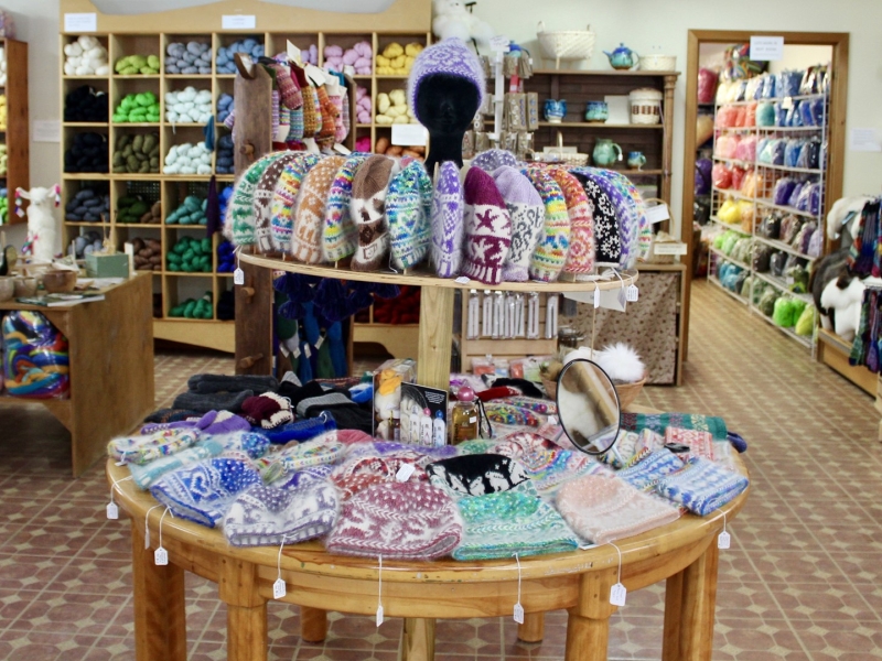 Inside gift shop display of woolen knit products and yarns