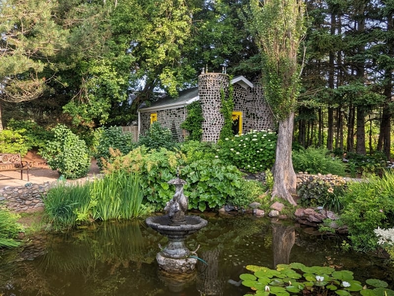 Chapel seen in distance with lilly pond in front