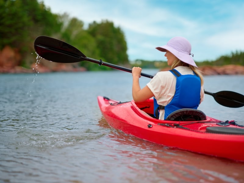 Woman in kayak at Basin Head, PEI
