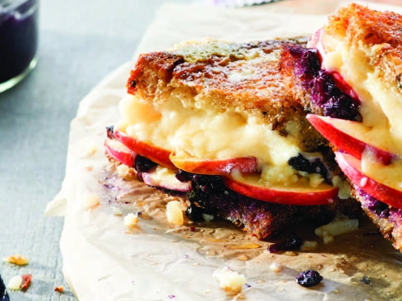 Image of Grilled Cheese with Apple + Wild Blueberry Chutney sandwich on cutting board