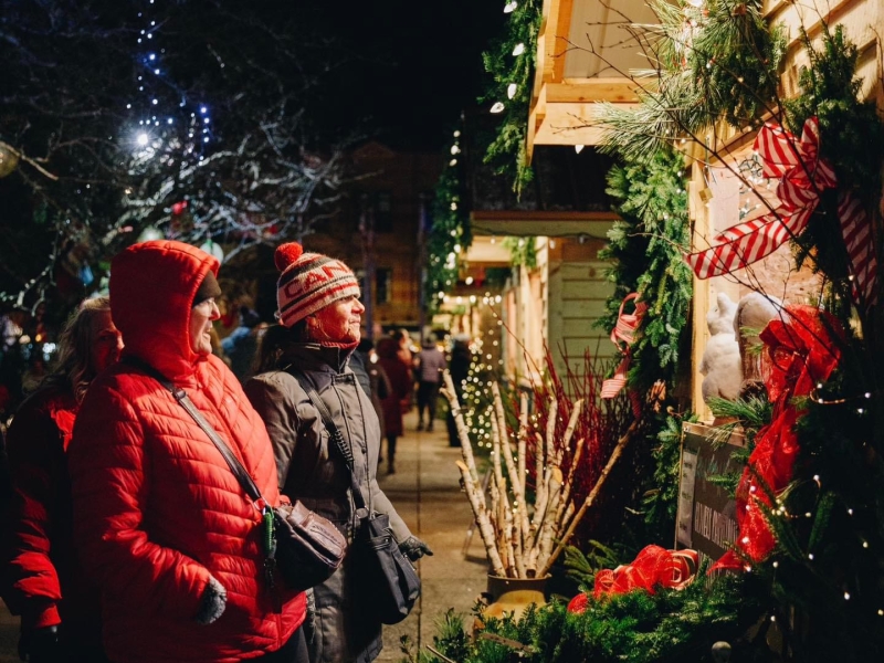 Two people stop at outdoor CHristmas shop in downtown Charlottetown