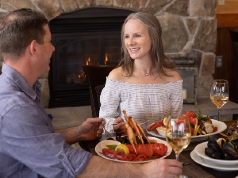 Couple dining on lobster at fine dining restaurant in PEI