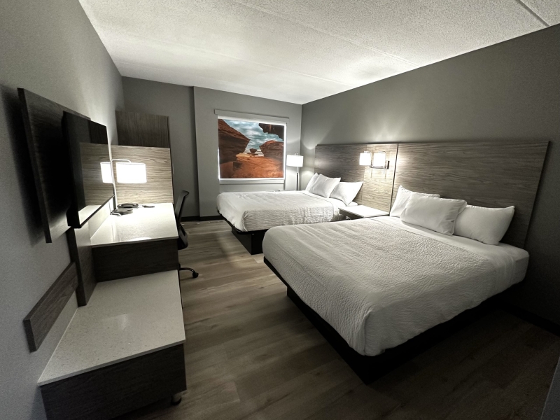 photo of two beds and motel room at days inn. white coverlets with grey interior room