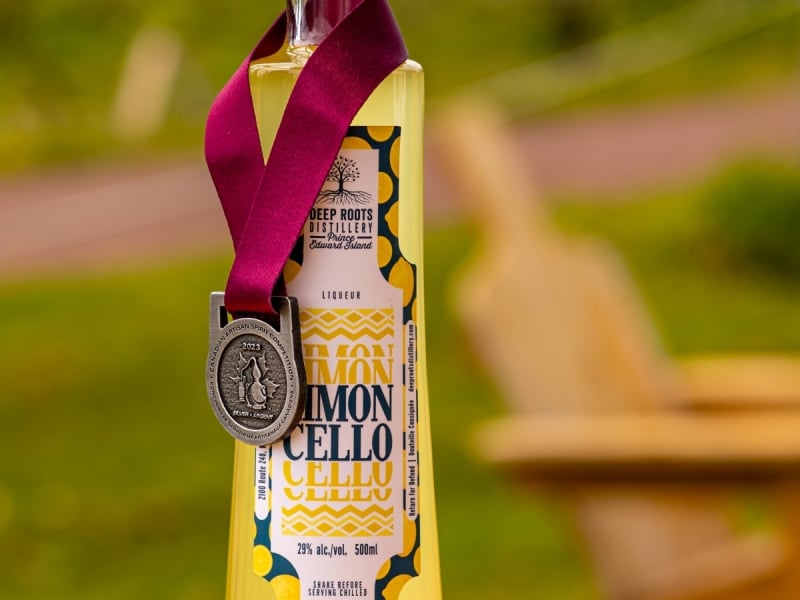 Bottle of Limoncello from Deep Roots Distillery adorned with award ribbon