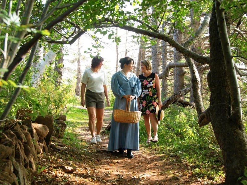 Costumed tour guide takes visitors through Haunted Wood at Green Gables Heritage Place, PEI