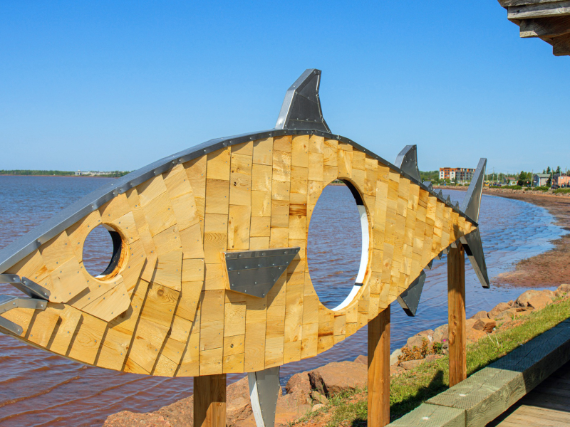 Holy Mackerel art installation stands along waterfront in Summerside on a summer day