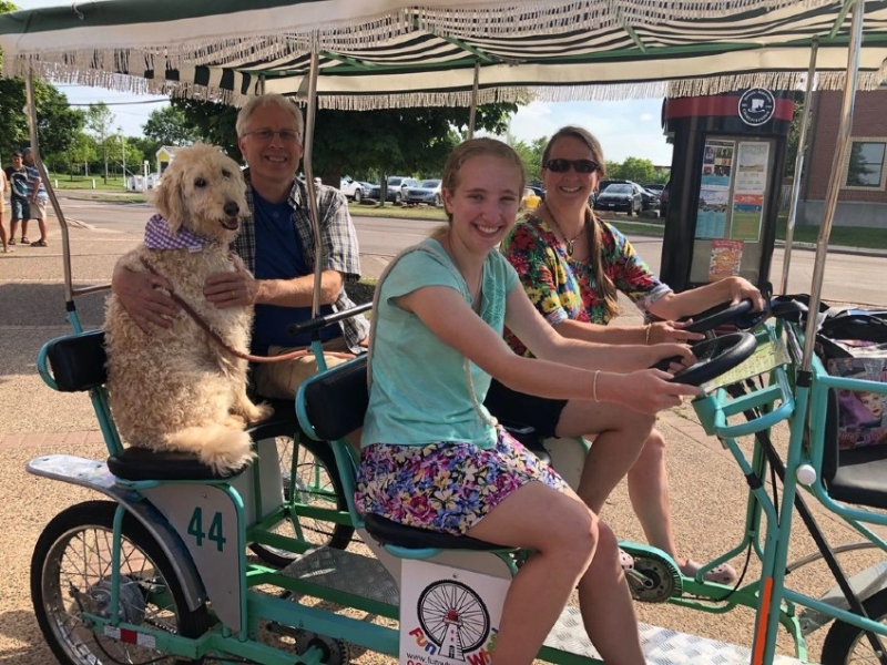 Family and their dog on a Surrey bike