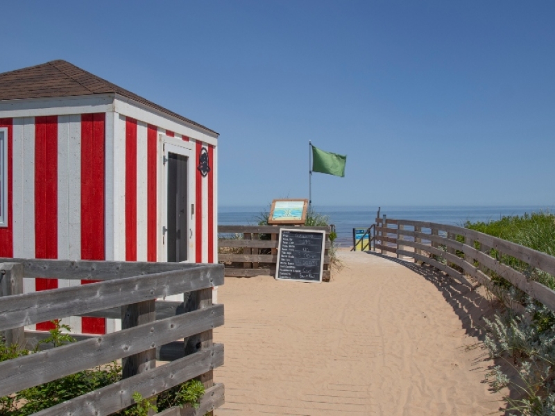 Red and white surf guard hut at entrance to beach at Greenwich - PEI National Park