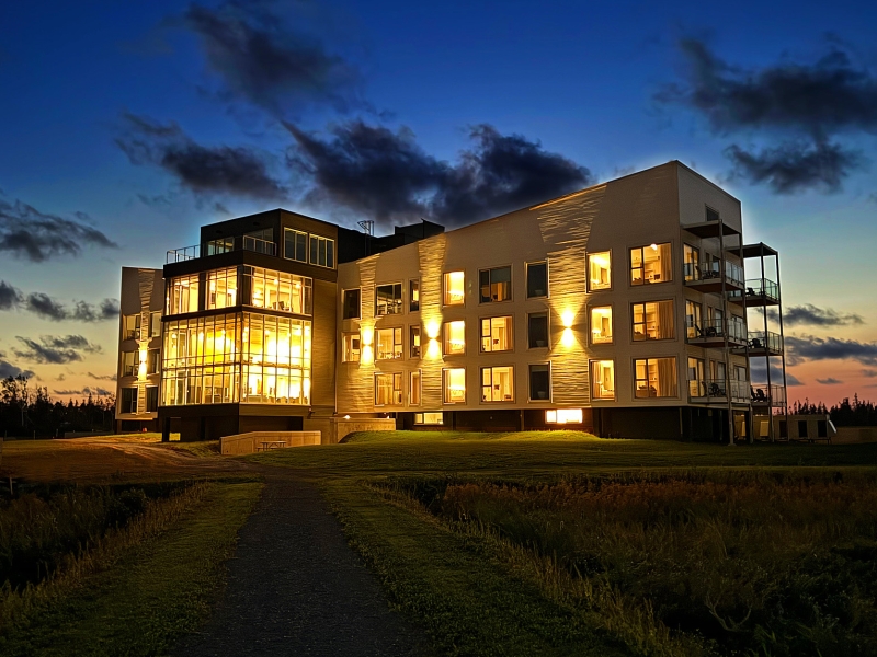 The Hotel Acadia at Blackbush Beach Resort at night