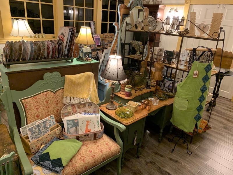 Interior showing vintage collectables, antique furniture and giftwares of Songbird Cottage 
