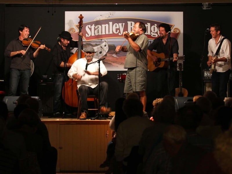 Group of six musicians perform on stage at Stanley Bridge Hall