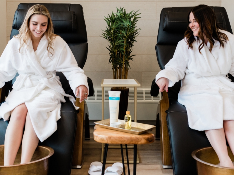 Two women having a foot soak at Mill River Resort Spa