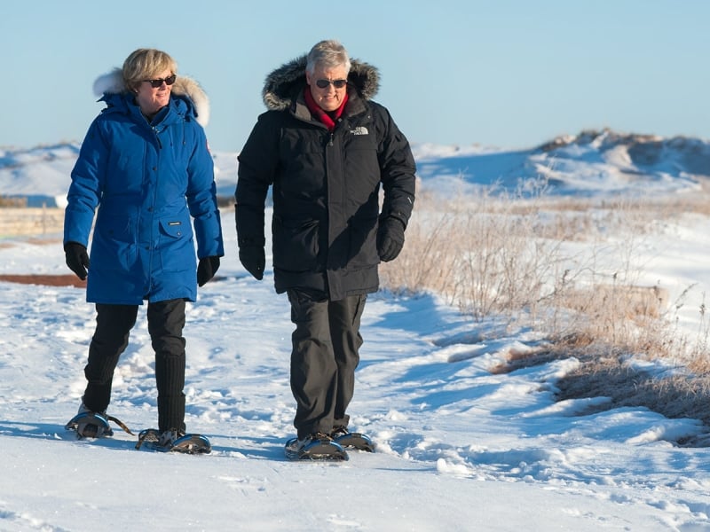 Two people snowshoe in North Rustico near PEI National Park