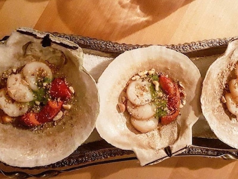 Scallop appetizer served on scallop shells
