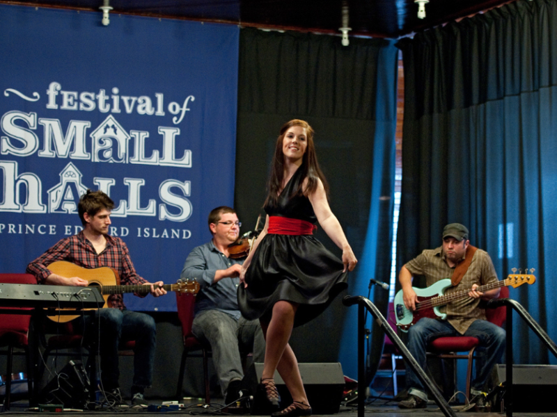 Step dancer on stage with band at Festival of Small Halls show