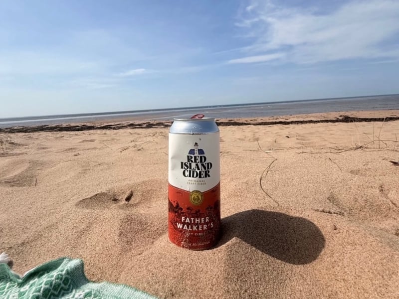 Can of Red Island Cider at the beach