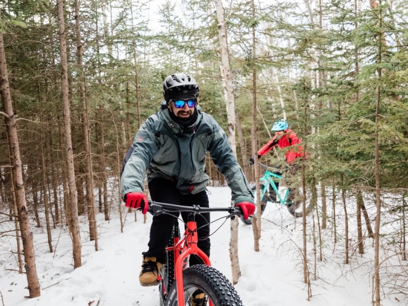 Two persons fatbiking at Rotary Park in winter, Summerside, PEI