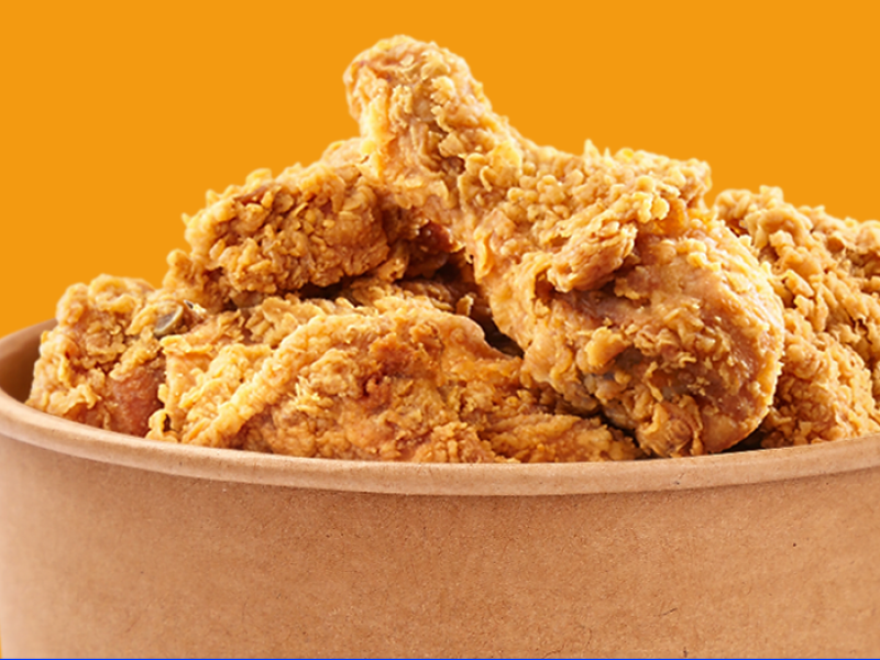 Image of bucket of fried chicken with yellow background