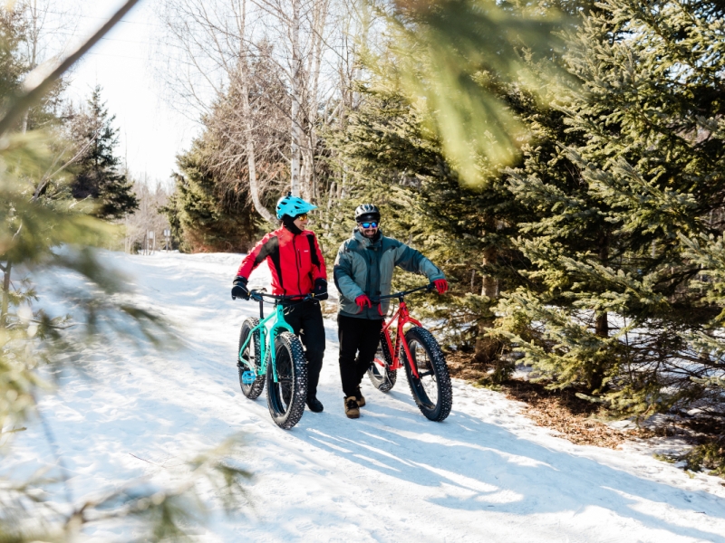 Couple on winter fat bikes in Rotary Friendship Park, Summerside