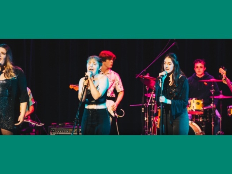 Group of musicians performing on stage