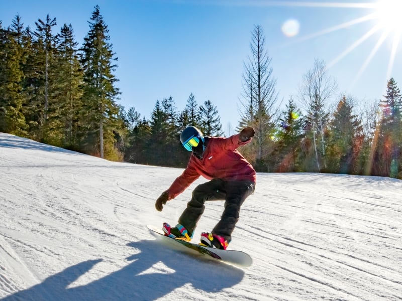 Snow boarder on sunny winter day at Brookvale Ski Park