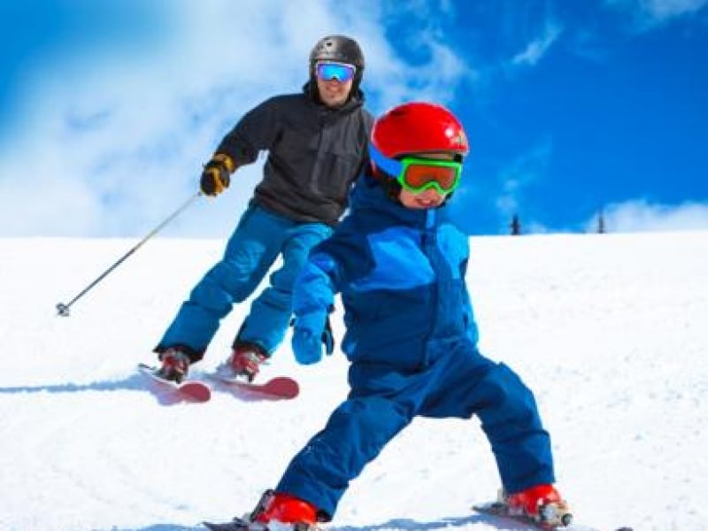 Parent and child skiing