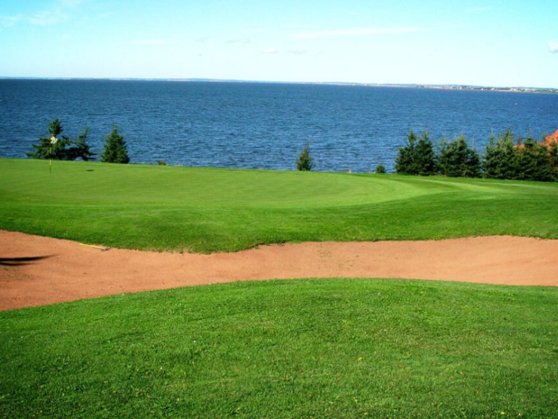 beautiful view of the greens and sandtrap overlooking the water at Belfast highland greens golf course