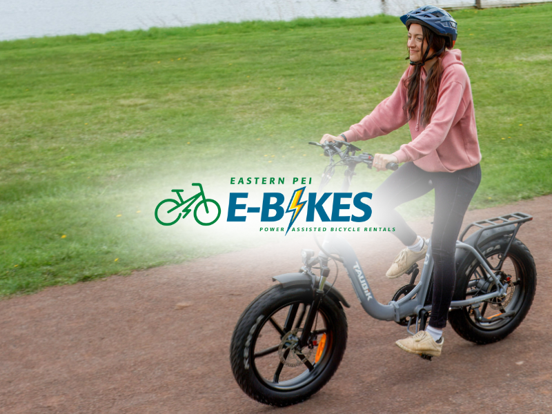 Eastern PEI E-Bikes Female riding e-bike on Confederation Trail