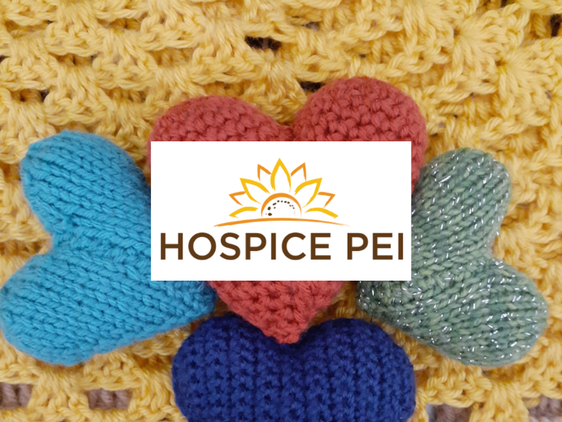 Image of knitted hearts and blanket in background with Hospice PEI logo in front