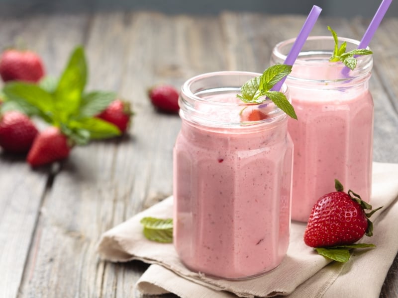 Stock image of two jars of strawberry milkshake